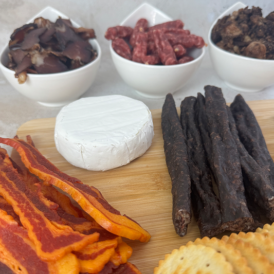 Close-up of Biltong Braai Box selection including biltong, droëwors and honey glazed bacon