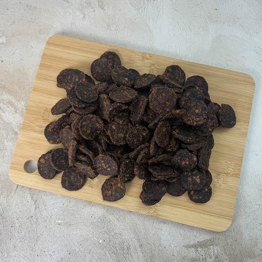 biltong chutney wheels laying on a wood board