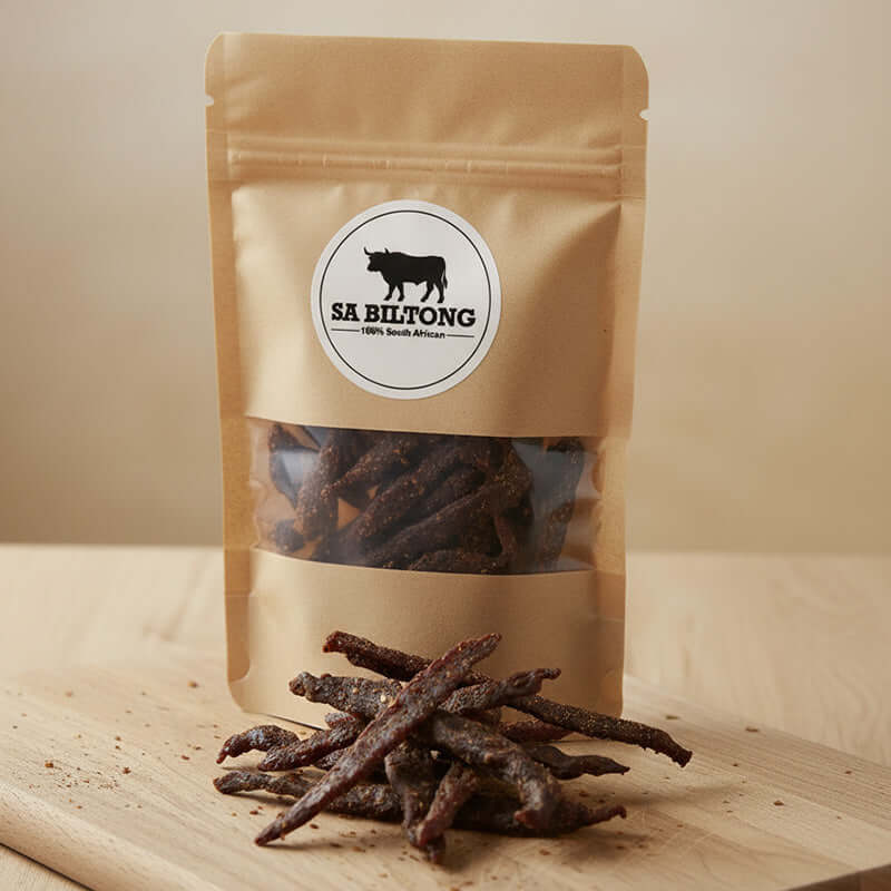 Chilli Biltong Sticks in a resealable bag with premium dried beef strips inside.