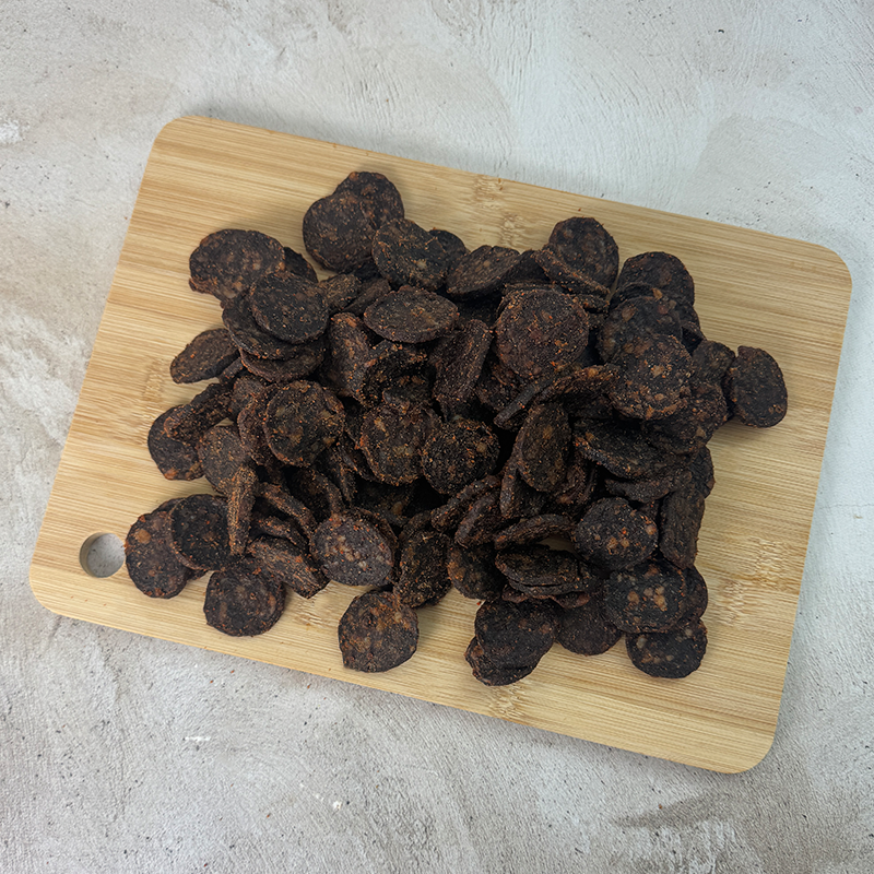 biltong chutney wheels laying on a wood board