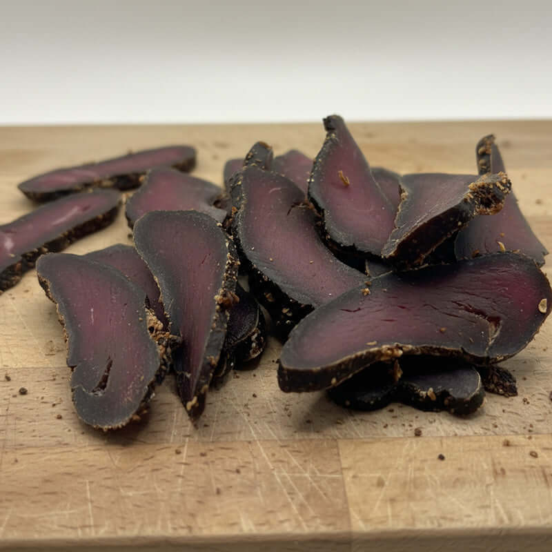 Kudu Biltong - Game Biltong slices showcasing premium South African game meat, lean and flavorful, perfect snack.
